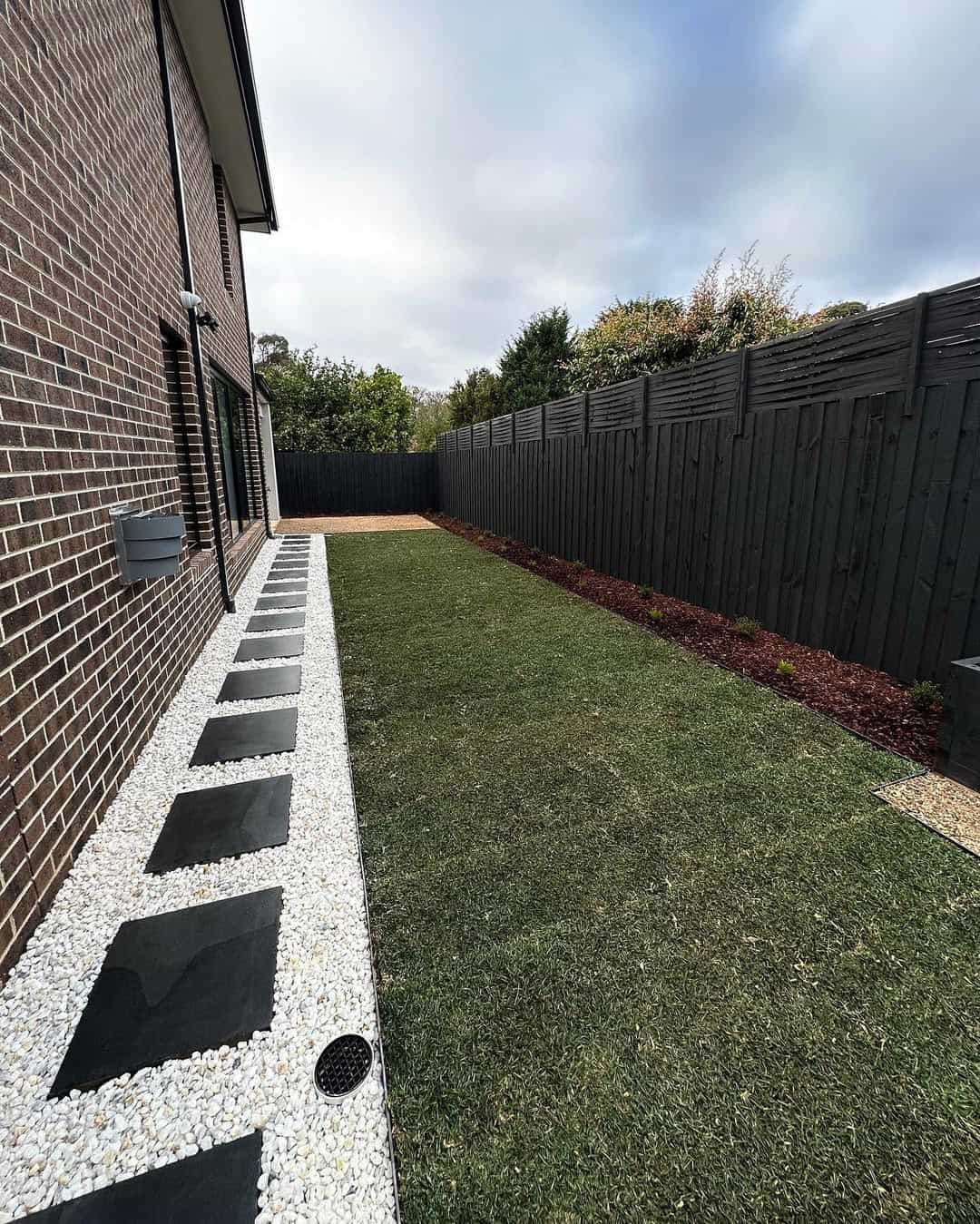 Front yard landscaping design in Melbourne with plants and clean edging